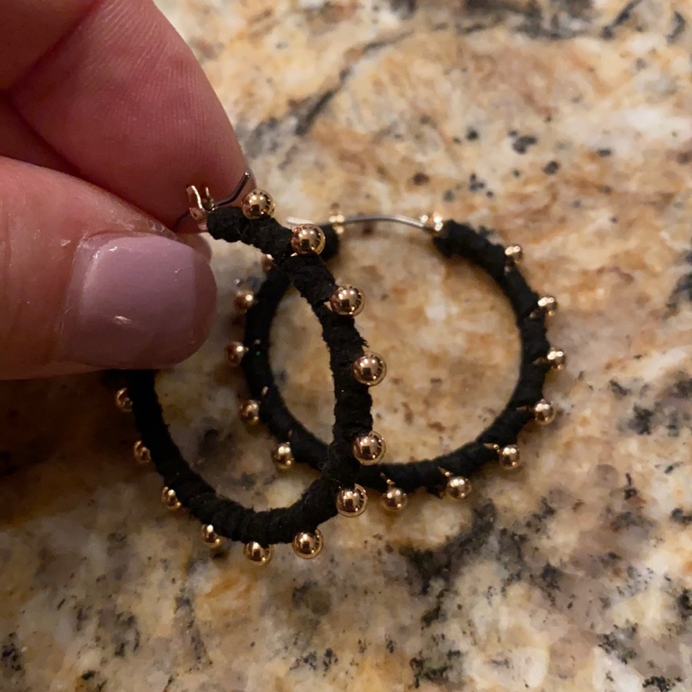 Black and gold colored hoop earrings
